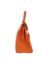 Kelly 28 in Orange Togo Leather, side view